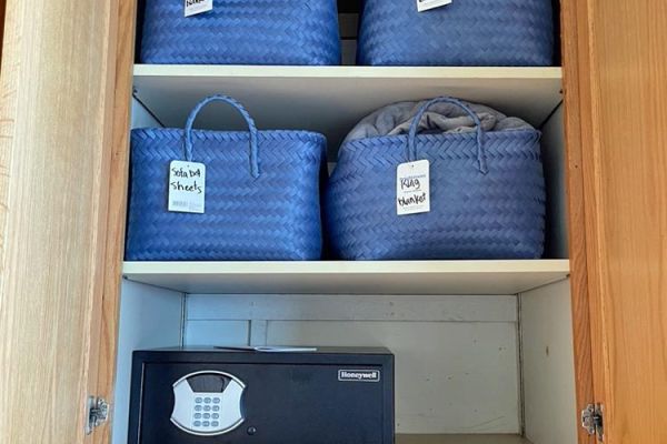 master bedroom linens storage and safe