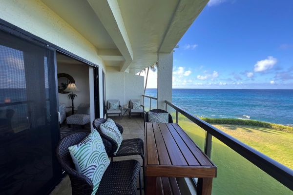 oceanfront lanai features tall table and seating to take in views