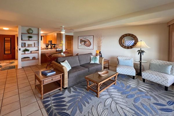 open floor plan living area with oceanfront view