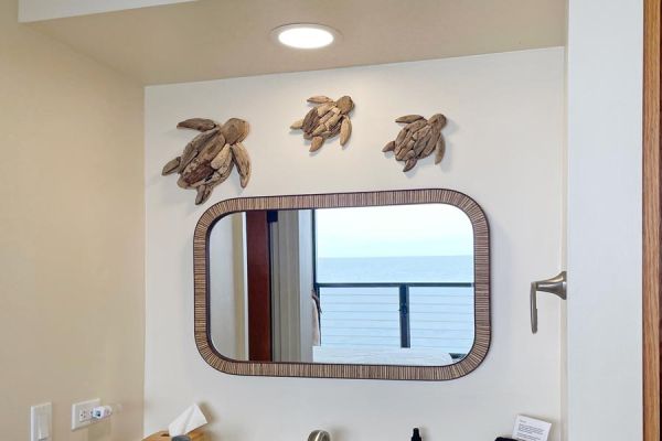 ocean view bedroom en suite sink area mirror reflects ocean view